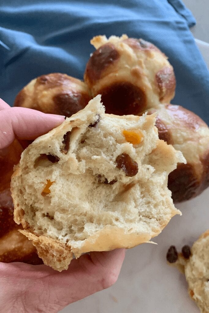 Sourdough hot cross buns made in Thermomix. Photo showing the soft inside full of dried fruit.
