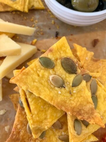 Pumpkin Sourdough Crackers topped with pumpkin seeds is one of the best sourdough cracker recipes.