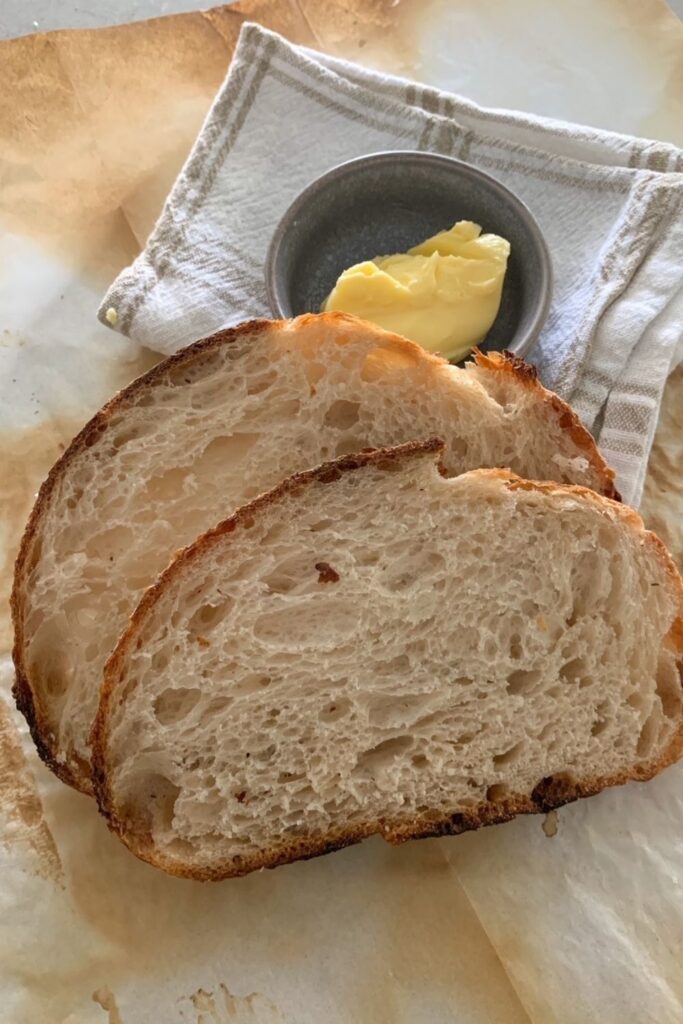 A higher sourdough hydration will give you a thinner crust and more open crumb.