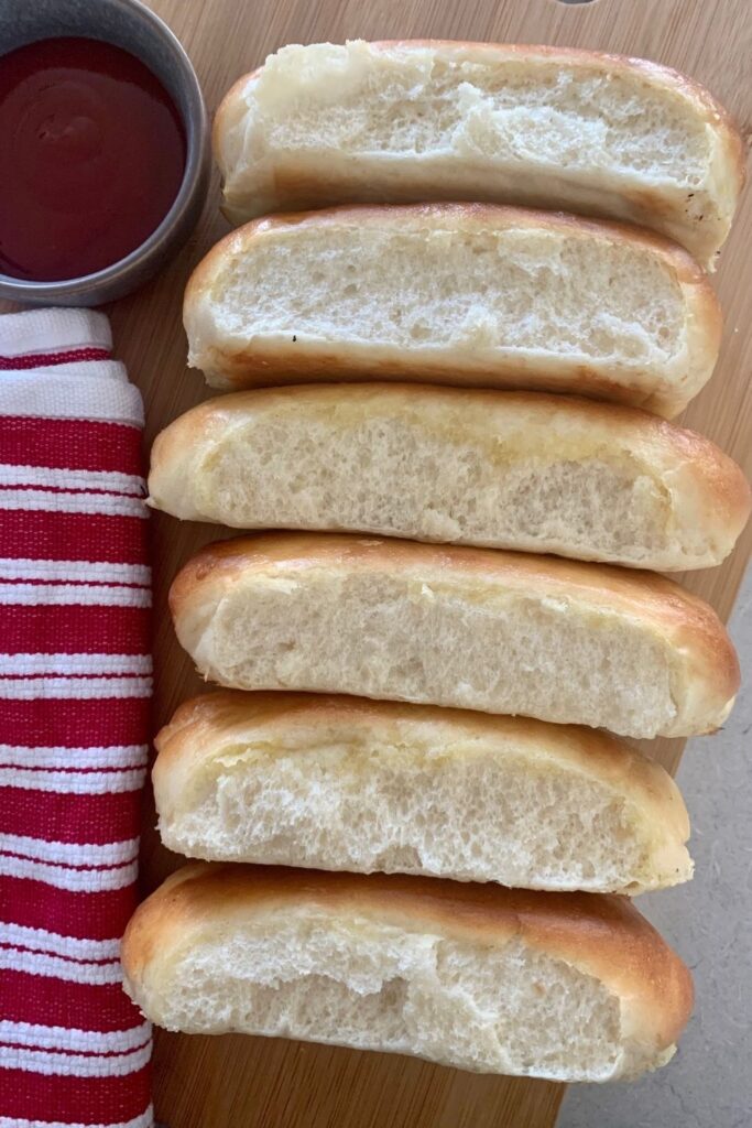 adding sugar to sourdough bread - 6 hotdog buns laying on their side next to a bowl of tomato sauce