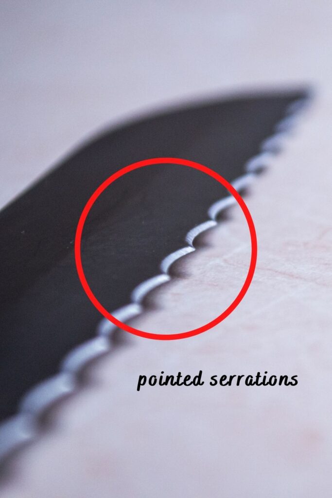 close up of pointed serrations on a bread knife