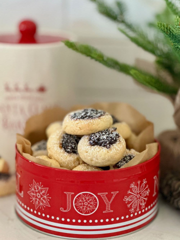 BEST CHRISTMAS SOURDOUGH RECIPES TO GIFT - red Christmas tin filled to the brim with sourdough fruit mince cookies.