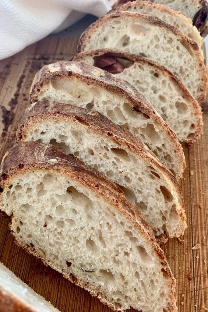 Perfectly sliced olive sourdough bread.