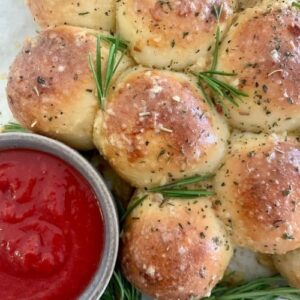 Serve cheesy garlic sourdough pull apart loaf with Marinara sauce