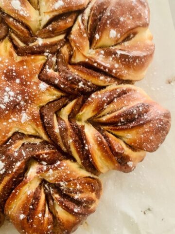 CLOSE UP PHOTO OF HALF SOURDOUGH CHOCOLATE STAR BREAD