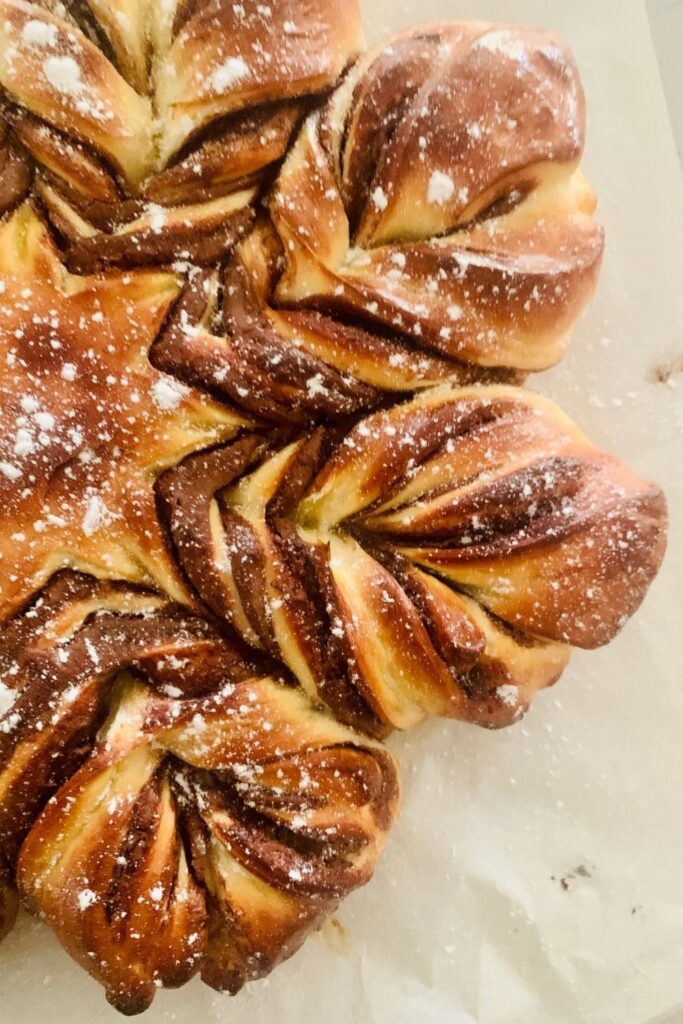 CLOSE UP PHOTO OF HALF SOURDOUGH CHOCOLATE STAR BREAD