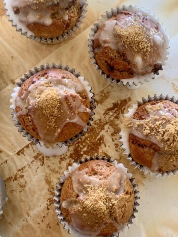 Sourdough gingerbread muffins topped with sugar glaze and sourdough gingerbread dust