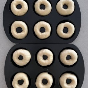 2 x 6 hole donut trays filled with shaped sourdough donuts