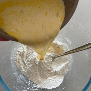 Sourdough Discard Waffles Recipe - adding liquid ingredients to dry ingredients.