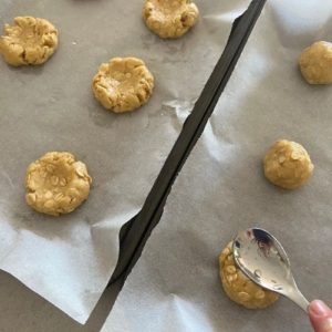 sourdough Anzac Biscuits flattened with a wet spoon