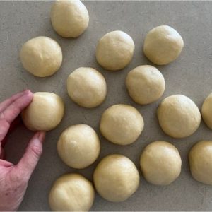 shape sourdough brioche buns into balls.