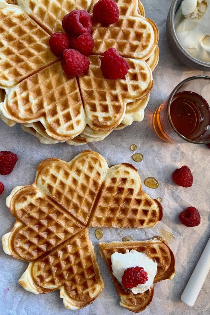 No Oven Sourdough Recipes - easy no wait sourdough waffles served with icecream, maple syrup and raspberries.