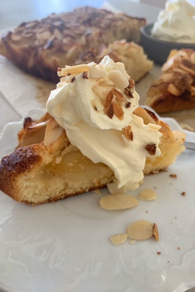 Sourdough Discard Apple Cake served with whipped cream