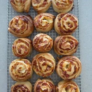 Sourdough pinwheels cooling on a wire rack