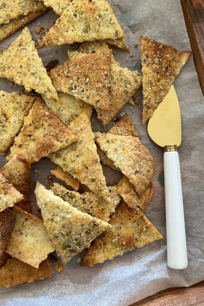 Sourdough Vegan Crackers displayed on a tray with a palette knife.