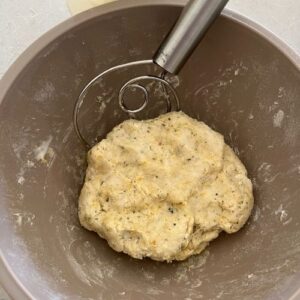 Pliable dough formed in the bowl for sourdough vegan crackers.