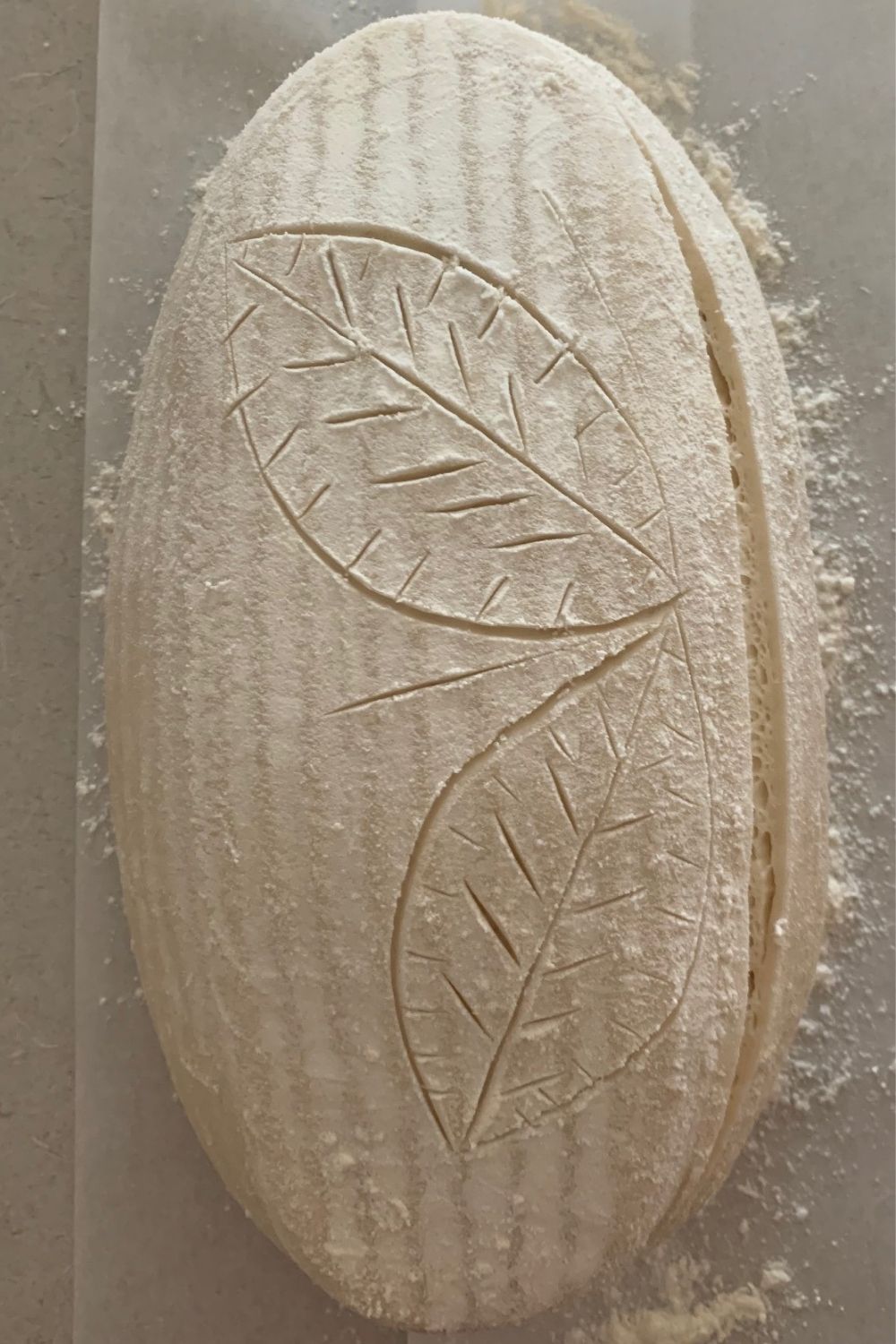 How score sourdough using a stencil 