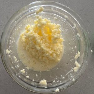 Butter and buttermilk in a wide mouthed mason jar