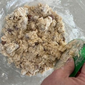 Bringing together wet and dry ingredients with a dough scraper