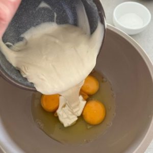 Adding eggs, sourdough starter and vanilla to make sourdough biscotti