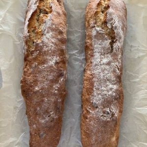 Two logs of sourdough biscotti cooling while out of the oven.