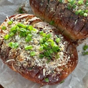 Sourdough garlic bread topped with chopped chives