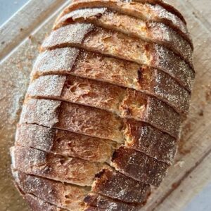 Sourdough Garlic Bread Recipe - slice the loaves while leaving them still attached at the bottom.