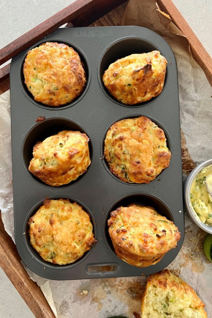 SOURDOUGH ZUCCHINI MUFFINS WITH CHEESE AND CHIVES IN A 6 HOLE MUFFIN TIN