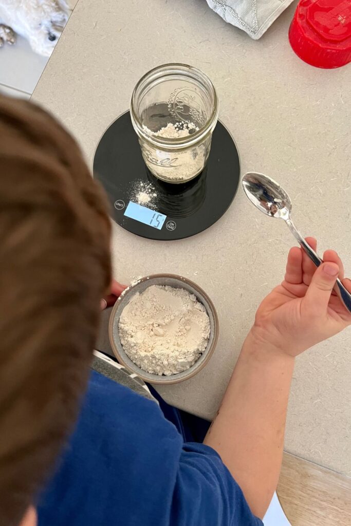 Teach kids how to bake sourdough by showing them how to make a sourdough starter.