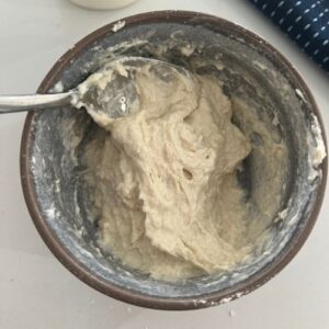 Mixing flour and yogurt together to make a yogurt sourdough starter