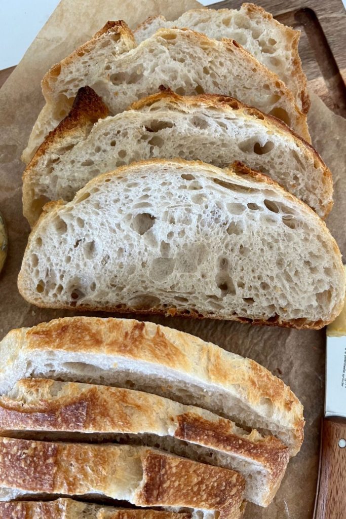 Small batch sourdough bread sliced open to reveal crumb.