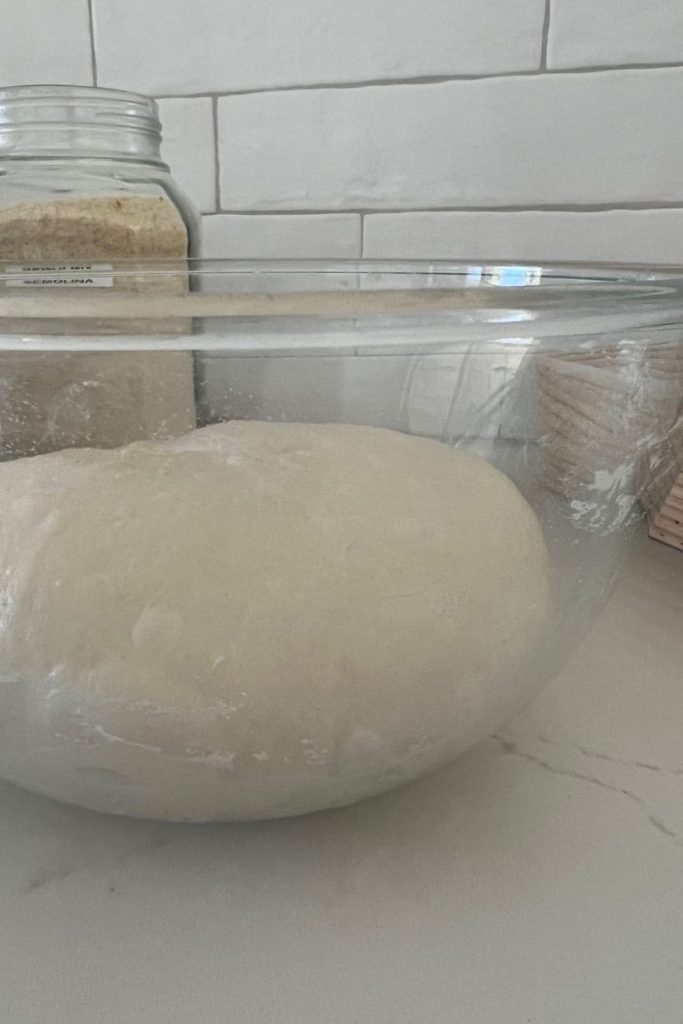 A bowl of sourdough that has doubled in size during bulk fermentation.