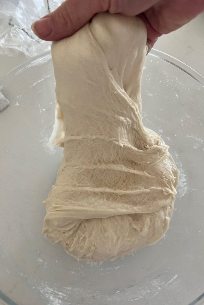 sourdough that is being stretched and folded.