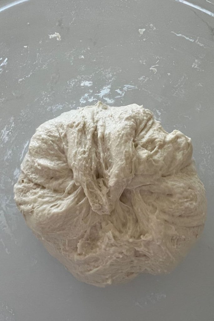 Ball of sourdough that has been pulled together to form a ball.