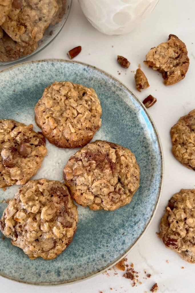 Sourdough Discard Cowboy Cookies sitting on a blue stoneware plate.