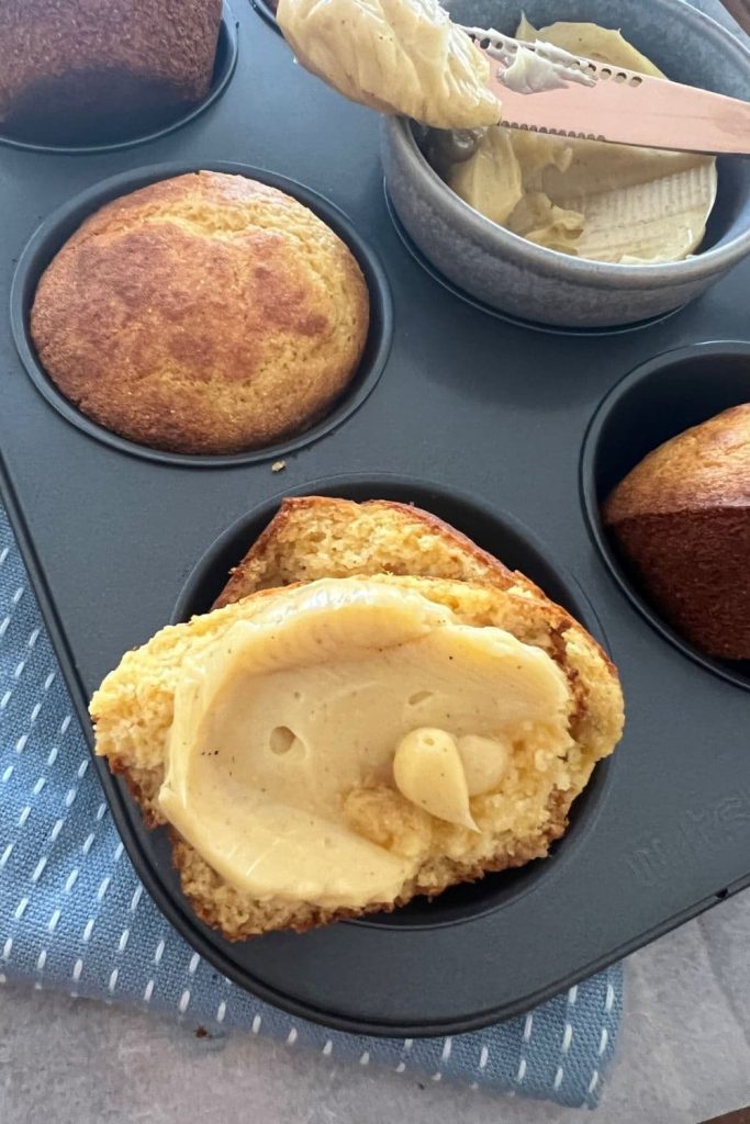 Sourdough cornbread muffins are an easy sourdough muffin recipe and they're delicious spread with cinnamon honey butter.