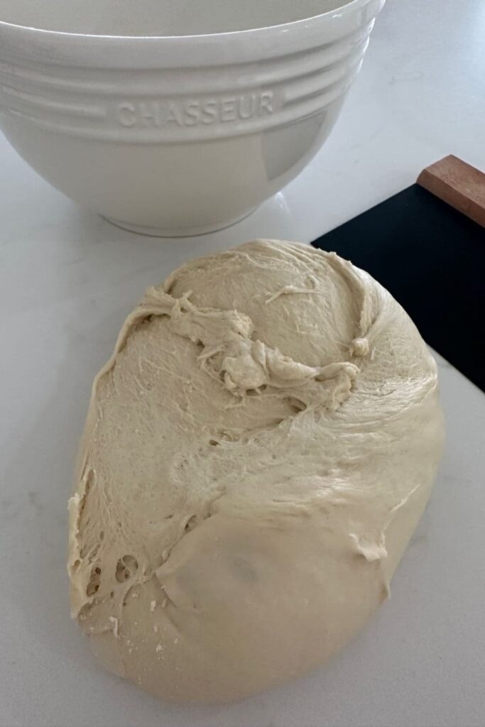 Sourdough French Bread dough that has been tipped out of the bowl and onto the counter top.