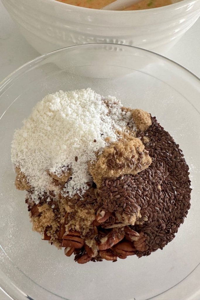 A bowl of dry ingredients used to make sourdough Morning Glory Muffins.