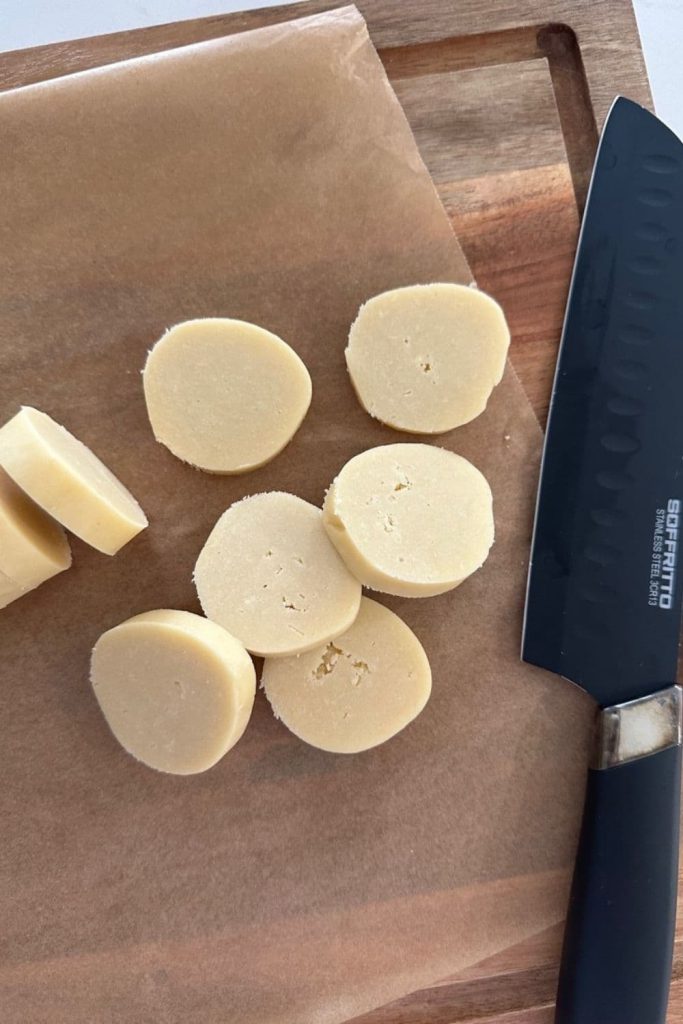 shortbread dough that has been sliced into rounds and is ready to bake.