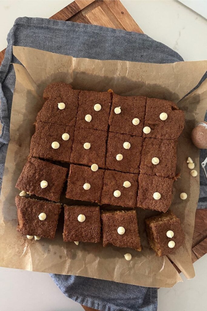 Sourdough blondies topped with white chocolate chips.