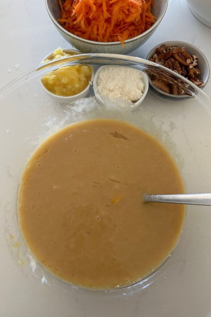 Bowl of wet ingredients used to make sourdough carrot cake.