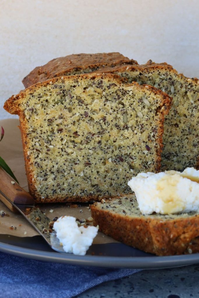 Seedy sourdough breakfast loaf served with whipped ricotta cheese and honey.