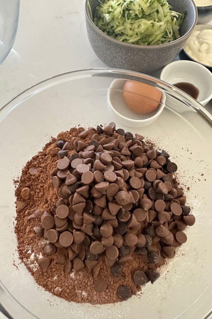 Bowl of dry ingredients before they are mixed together to make sourdough chocolate zucchini muffins.