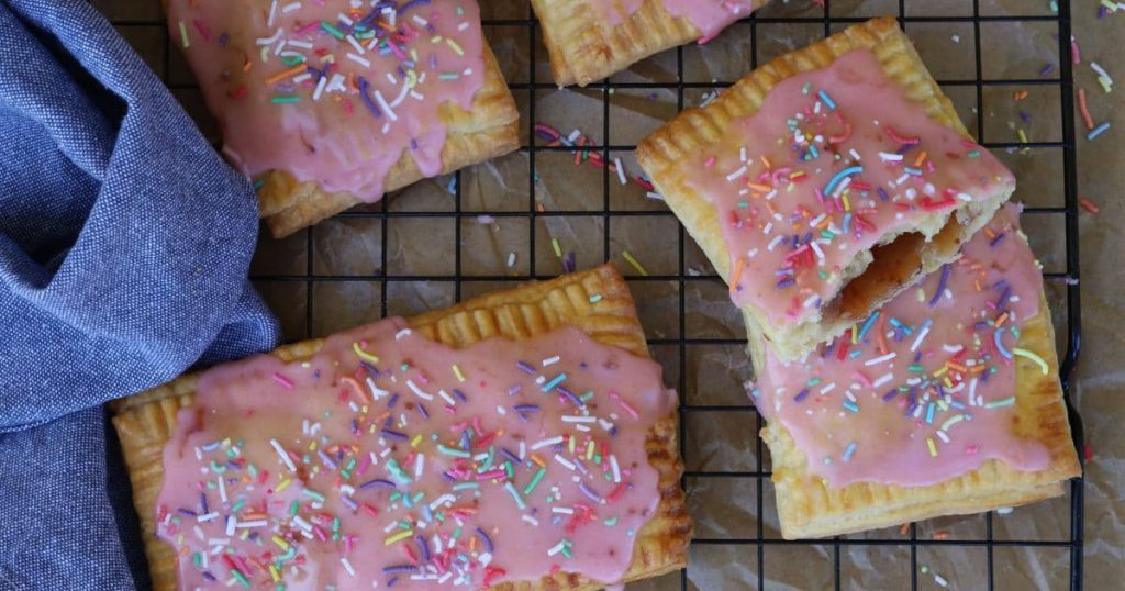 Strawberry Frosted sourdough pop tarts made using 200g of sourdough discard. You can see the filling inside the pop tarts.