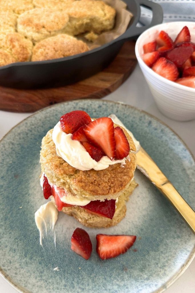 A sourdough strawberry shortcake dressed with vanilla whipped cream and fresh strawberries.
