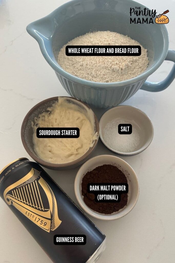 A flat lay of ingredients necessary to make a loaf of sourdough Guinness bread.