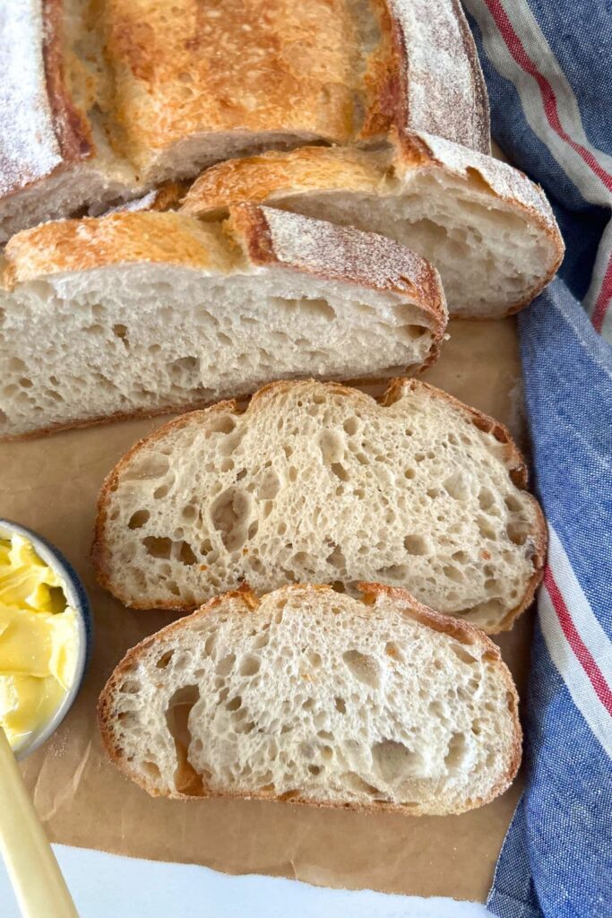 A photo of high hydration sourdough bread used to demonstrate that a high hydration loaf will lose more weight when baked than a lower hyrdration loaf.