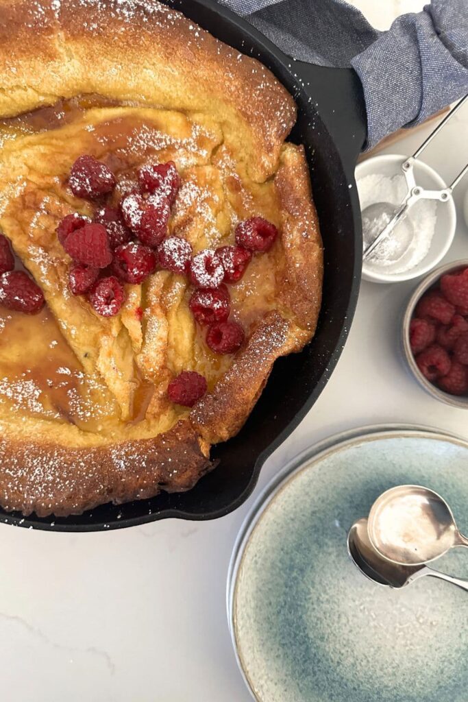 A photo of a sourdough Dutch baby pancake made with sourdough starter and lots of eggs.