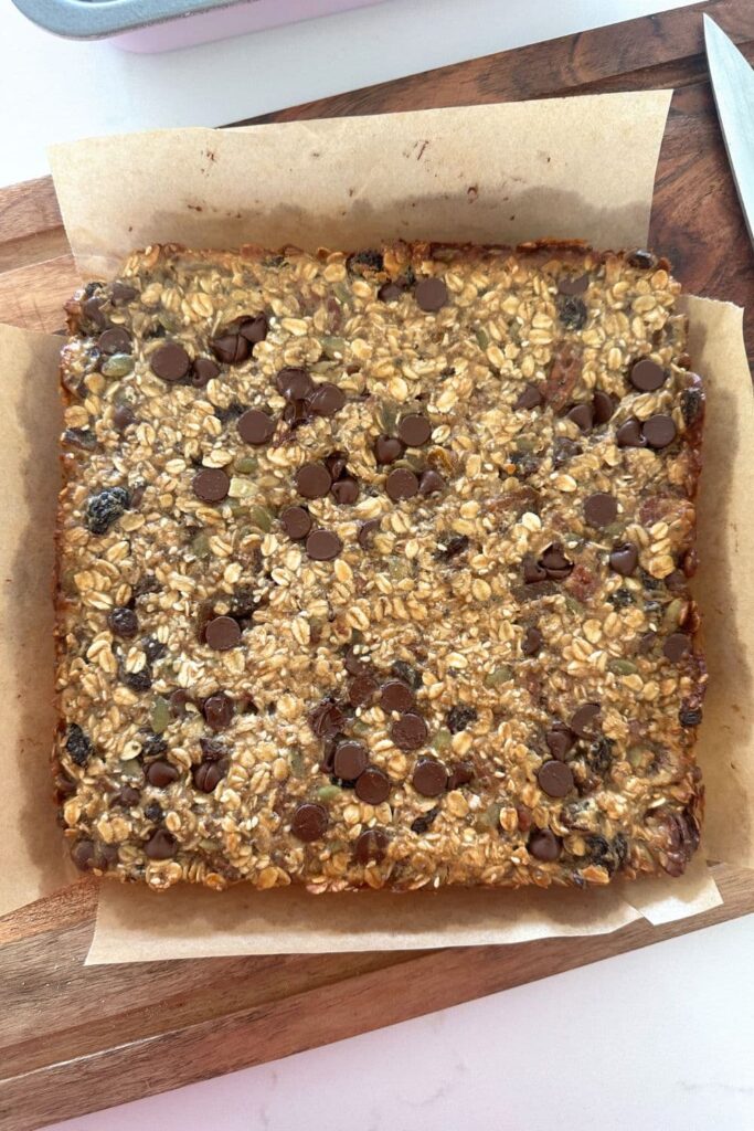 A slab of baked sourdough granola before being sliced into individual bars.