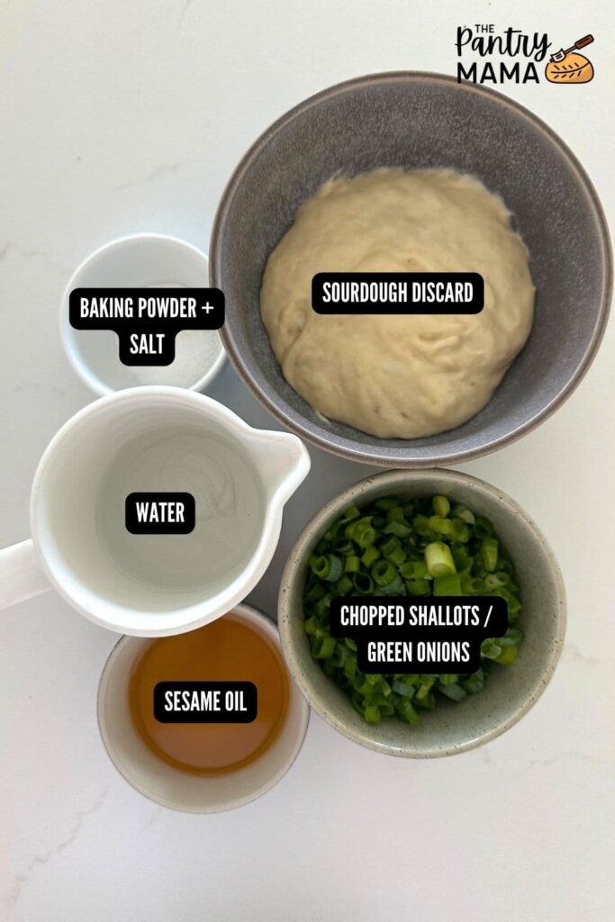 Flat lay of ingredients necessary to make sourdough discard scallion pancakes.